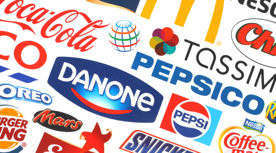 KIEV, UKRAINE - MAY 07, 2015:Collection of popular food logos companies printed on paper:Coca-Cola, Mars, Pepsico, Nestle, Tesco and others