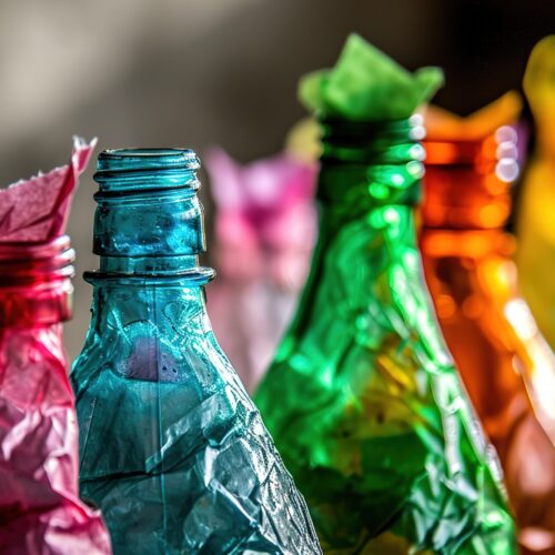 A colorful collection of broken plastic bottles is a powerful illustration of recycling and waste management efforts